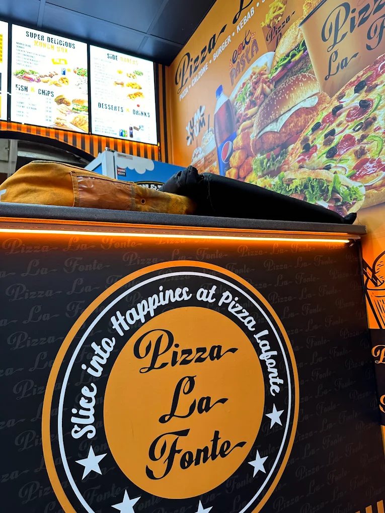 Pizza La Fonte sign reading Slice into Happiness